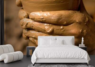 Close up of hands of the potter creating utensils Wall mural