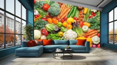 Assortment of fresh colorful organic vegetables on wooden pine table, healthy food background, top view, selective focus Wall mural