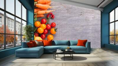 Autumn vegetables background: tomatoes, carrots, pumpkin, runner beans, chilies Wall mural