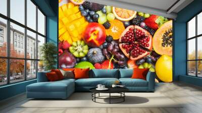 Delicious healthy fruit background mango papaya strawberries oranges passion fruits berries, top view, selective focus Wall mural