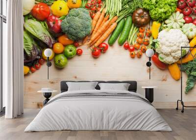 Fresh farm produce, organic vegetables on wooden pine table, healthy background, copy space for text on the bottom, top view, selective focus Wall mural