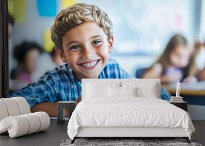 A boy is sitting at a desk with a blue shirt and a yellow pencil Wall mural