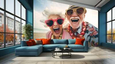 A couple of older people are posing for a picture on the beach Wall mural