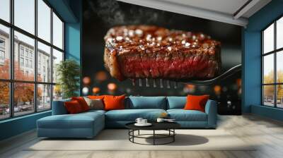 A fork is holding a piece of meat that is partially cooked Wall mural