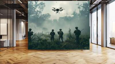 A group of soldiers are standing in a forest with a drone flying overhead Wall mural