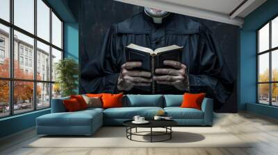 A man in a black robe is reading a book Wall mural