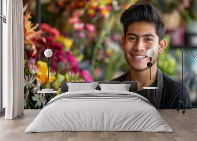 A man with a black shirt and apron is smiling in front of a flower shop Wall mural