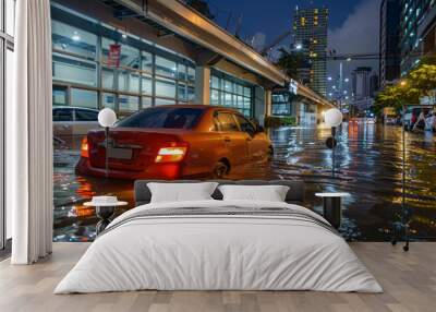 A red car is stuck in a flooded street Wall mural