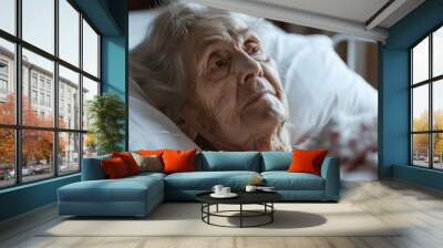 A woman in a hospital bed with a white sheet Wall mural