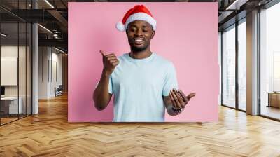 African american man wearing Santa hat Wall mural