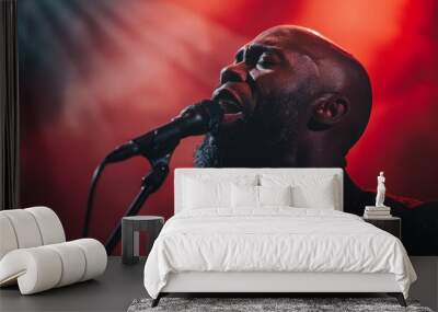 Close-up of a handsome man singing a sensual song on stage Wall mural