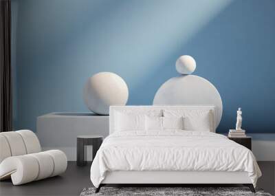 Close-up of a minimalistic white marble podium with geometric shapes, spheres on a blue background for a product demonstration with copy space. Wall mural