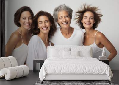 Happy smiling confident Female models of different ages demonstrate their natural bodies and faces against a gray background in the studio. Mom and daughters, Body positive, Natural Beauty concept. Wall mural