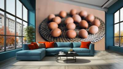 Raw chicken eggs on table Wall mural