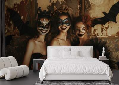 Three women are dressed in Halloween costumes and are posing for a picture Wall mural