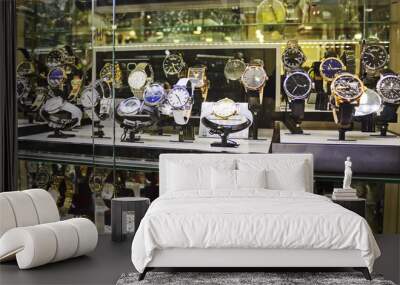 Showcase with wrist watches. Collection of expensive luxury watches from gold, silver and leather Wall mural