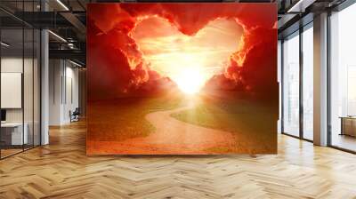  Red heart shaped clouds at sunset. Beautiful landscape with road. Love background with copy space. Road to love Wall mural