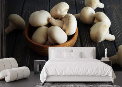 Fresh champignon mushrooms on wooden table Wall mural