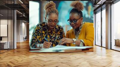  Two Afro American  fashionable 50 year old women signing a piece of paper at the office Wall mural