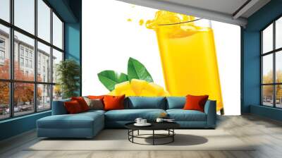 Mango juice splash out of glass with mango fruit on white background Wall mural