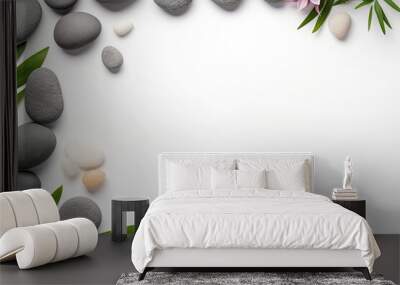 A flat arrangement featuring spa stones on a white background, designed with an open area for adding text. Wall mural