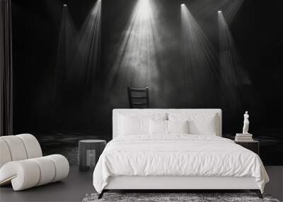 A lone wooden chair on a stage lit by soffits in black and white Wall mural