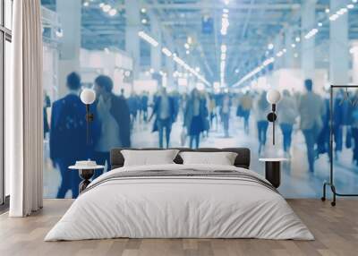 Blurry images of a trade fair in a large hall with people presenting products and activities Wall mural