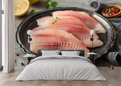 Bowl with fresh fish fillets for cooking including pangasius dolly fish tilapia and catfish Wall mural