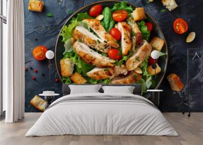 Chicken Caesar salad with tomatoes croutons Italian overhead view Wall mural