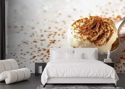 Classic tiramisu dessert on white surface with a spoon Wall mural