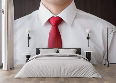 Close-up isolated background of a business man in men's fashion wearing a white shirt and red tie, with a soft focus. Wall mural