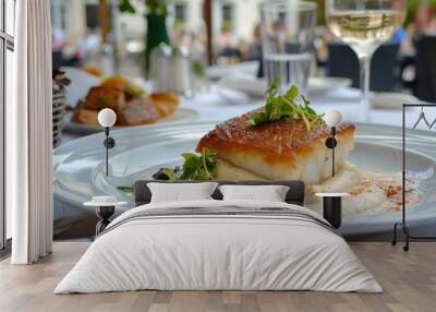 Cod fillet with chestnut puree and creamy sauce served outdoors Wall mural