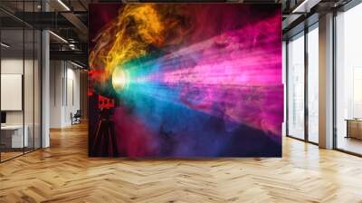 Colorful projector with wide lens smoke texture screening multimedia on black background at night Wall mural