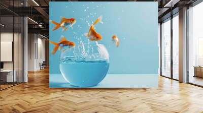 Goldfish leaping from blue fishbowl Wall mural