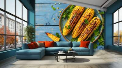 Grilled corn cobs with parsley on blue wooden surface Wall mural