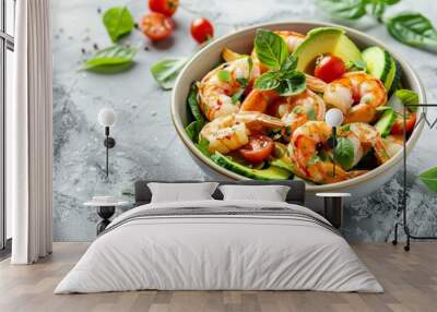 Healthy summer salad with shrimp avocado and cherry tomatoes in a bowl on a light table Concept of nutritious food Wall mural