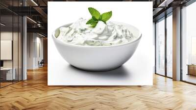 Isolated bowl of tzatziki sauce with sour cream or Greek yogurt on white background Wall mural