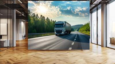 Logistic and freight transport truck moves on sunlit country highway in spring Wall mural