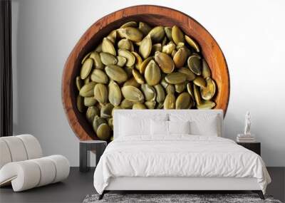 Organic pumpkin seeds in wooden bowl top view on white background Healthy food concept Wall mural