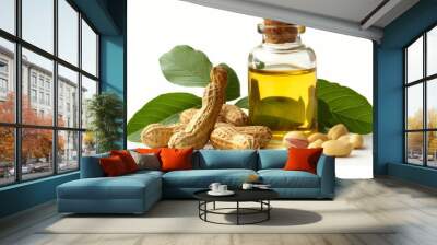 Peanut oil and peanuts with leaves in clear bottle on white background Wall mural