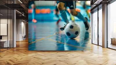 Players participating in indoor futsal matches in a sports hall Futsal training and dribbling drills in an indoor soccer league Wall mural