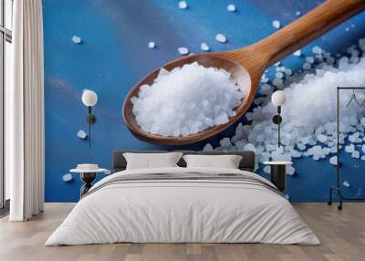 Salty background for advertising with coarse salt crystals and a wooden spoon Wall mural