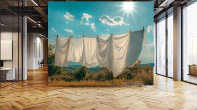 Sheets drying outside on a clothesline under the sun Wall mural