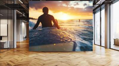 Surfer relaxing on surfboard at sunset waiting for next wave Worldwide sport travel concept Sunny filter with lens drops for composition Wall mural