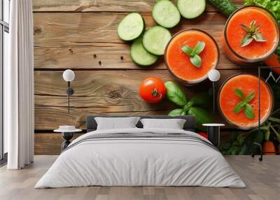 Top view of a wooden table with a fresh vegetable smoothie made of tomato cucumber and carrot Wall mural