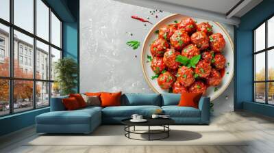 Top view of homemade meatballs with tomato sauce and spices on plate with grey background Wall mural