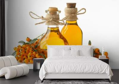 Two bottles of sea buckthorn oil on a white background Wall mural