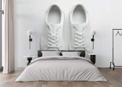 Two white sneakers for men on white background seen from above Wall mural