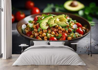 Vegan salad with roasted chickpeas avocado and tomatoes in a white bowl Wall mural