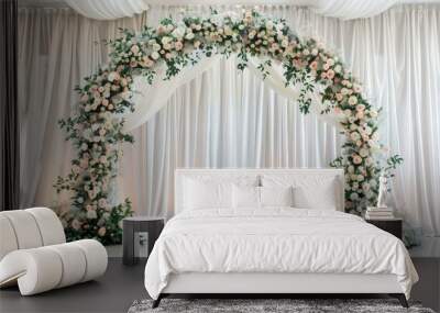 White flower arch in a restaurant s wedding banquet room adorned with greens and a backdrop of white cloth Wall mural